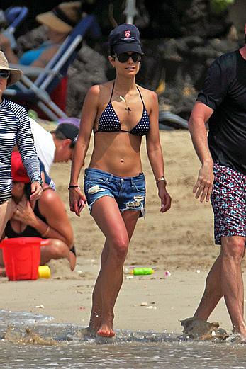 Jordana Brewster in bikini top and denim shorts at a beach in Hawaii