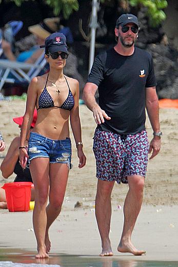 Jordana Brewster in bikini top and denim shorts at a beach in Hawaii