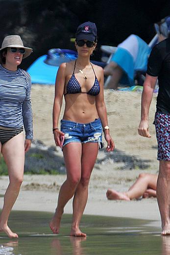 Jordana Brewster in bikini top and denim shorts at a beach in Hawaii