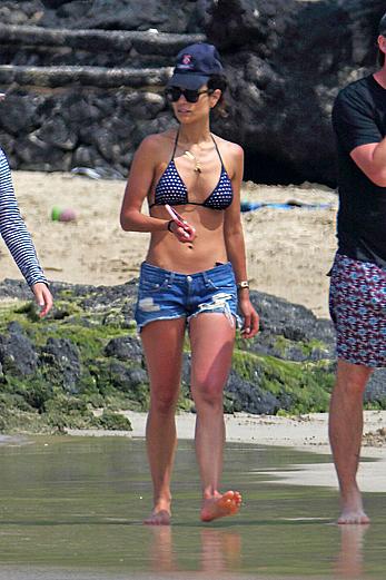 Jordana Brewster in bikini top and denim shorts at a beach in Hawaii