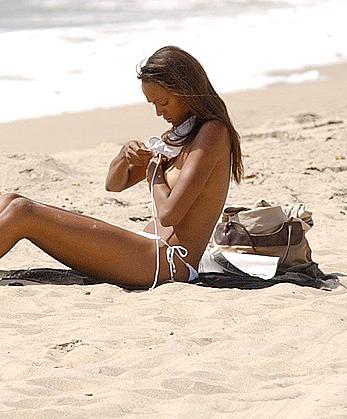 Judy Shekoni caught topless on a beach