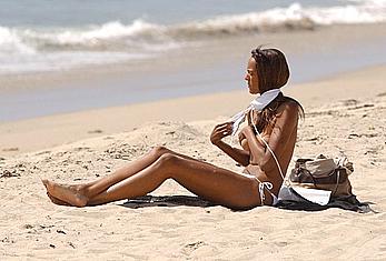 Judy Shekoni caught topless on a beach