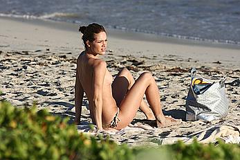 Julie Ordon topless on a beach