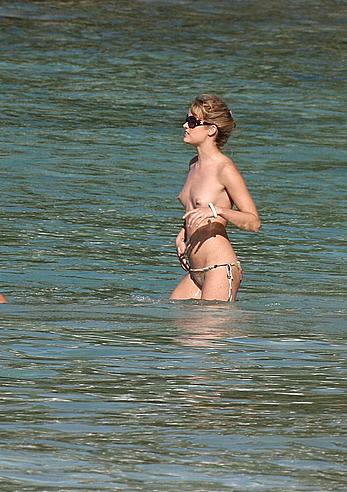 Julie Ordon topless on a beach