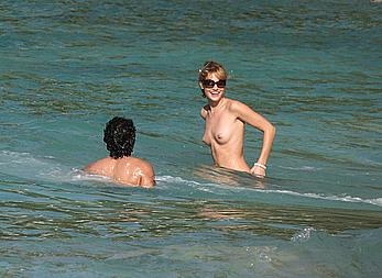 Julie Ordon topless on a beach