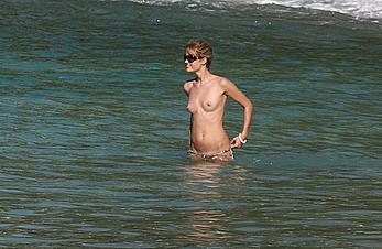 Julie Ordon topless on a beach