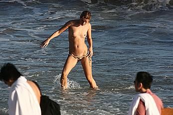 Julie Ordon topless on a beach