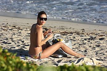 Julie Ordon topless on a beach