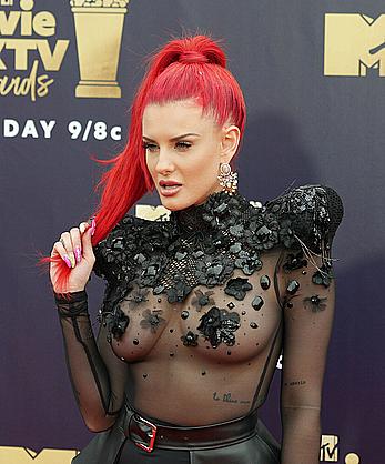 Justina Valentine posing braless in see through dress at the MTV Movie & TV Awards