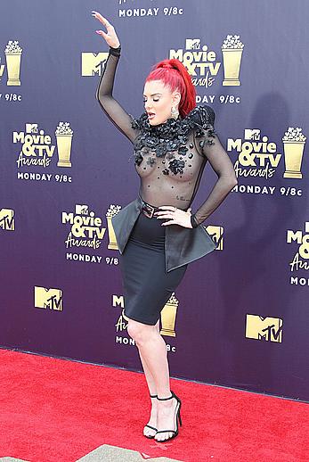 Justina Valentine posing braless in see through dress at the MTV Movie & TV Awards