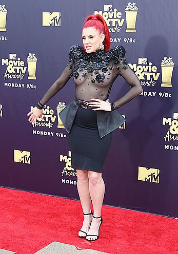 Justina Valentine posing braless in see through dress at the MTV Movie & TV Awards