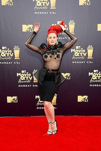 Justina Valentine posing braless in see through dress at the MTV Movie & TV Awards