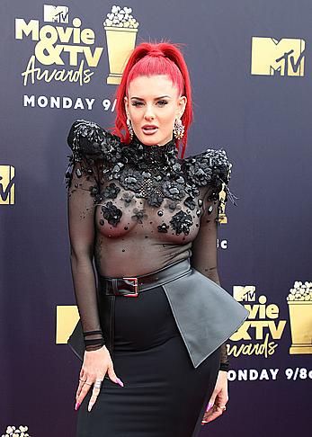 Justina Valentine posing braless in see through dress at the MTV Movie & TV Awards