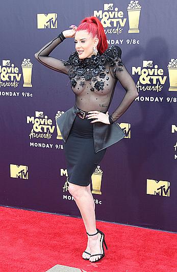 Justina Valentine posing braless in see through dress at the MTV Movie & TV Awards