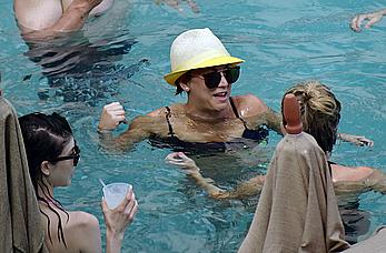 Kaley Cuoco wearing a bikini at a pool in Mexico