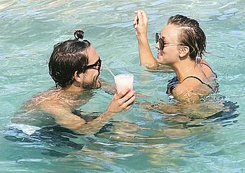 Kaley Cuoco wearing a bikini at a pool in Mexico