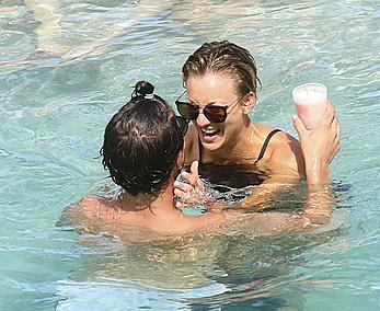 Kaley Cuoco wearing a bikini at a pool in Mexico