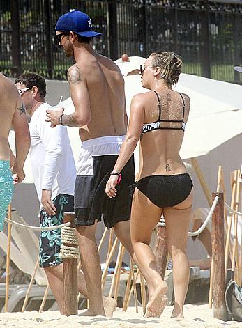 Kaley Cuoco wearing a bikini at a pool in Mexico