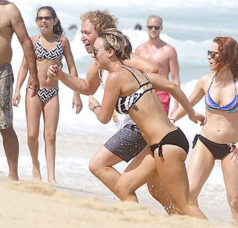 Kaley Cuoco wearing a bikini at a pool in Mexico