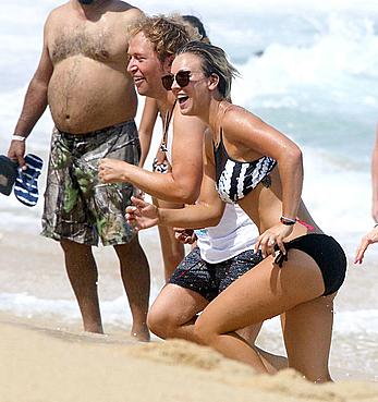 Kaley Cuoco wearing a bikini at a pool in Mexico