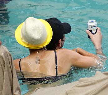 Kaley Cuoco wearing a bikini at a pool in Mexico