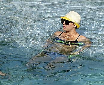 Kaley Cuoco wearing a bikini at a pool in Mexico