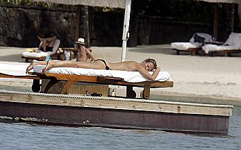 Karen Mulder relaxing topless in Mauritus near the beach