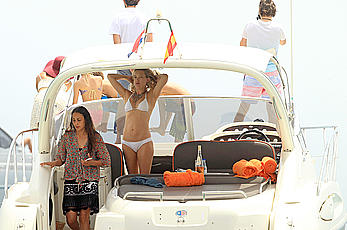 Kate Hudson in white bikini on a boat in Ibiza