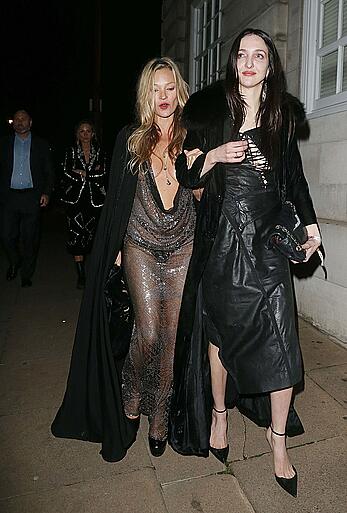 Kate Moss boob slip at Lets it all hang out partying in London