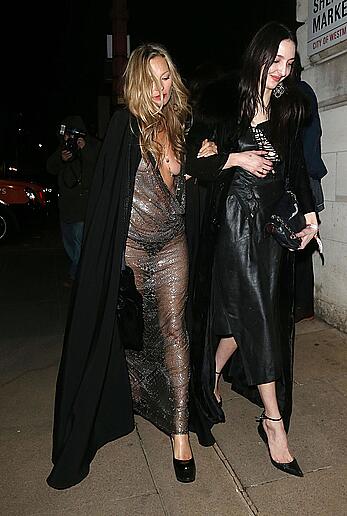 Kate Moss boob slip at Lets it all hang out partying in London