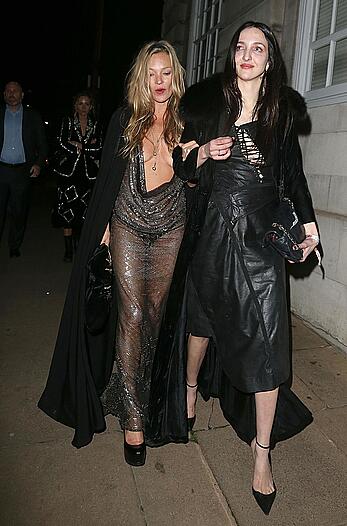 Kate Moss boob slip at Lets it all hang out partying in London