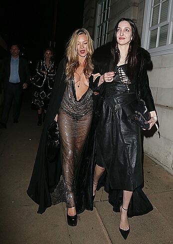 Kate Moss boob slip at Lets it all hang out partying in London