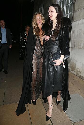 Kate Moss boob slip at Lets it all hang out partying in London