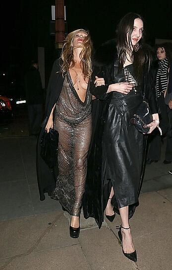 Kate Moss boob slip at Lets it all hang out partying in London