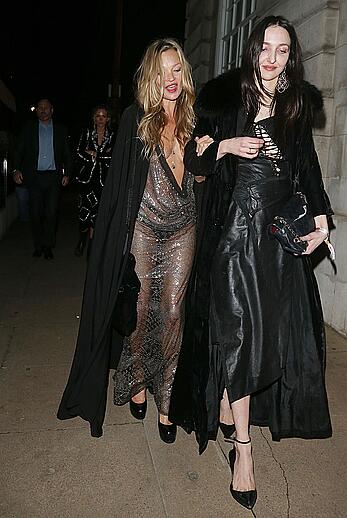 Kate Moss boob slip at Lets it all hang out partying in London