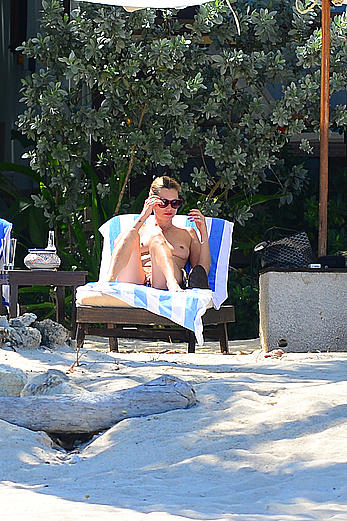 Supermodel Kate Moss caught topless on a beach in Jamaica