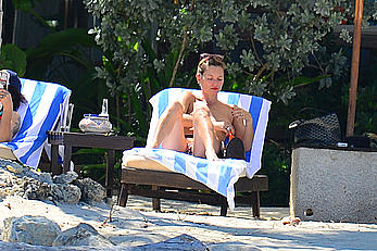 Supermodel Kate Moss caught topless on a beach in Jamaica