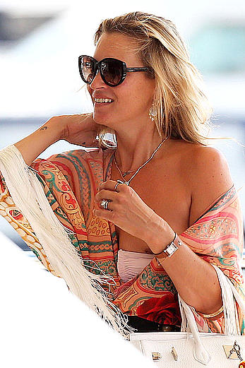 Kate Moss nipslip while boarding a yacht