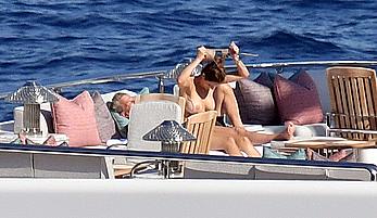 Katharine McPhee sunbathing topless on a yacht in Capri