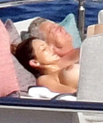 Katharine McPhee sunbathing topless on a yacht in Capri