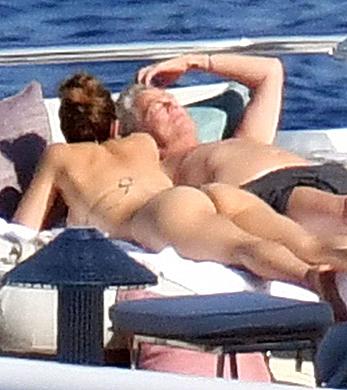 Katharine McPhee sunbathing topless on a yacht in Capri