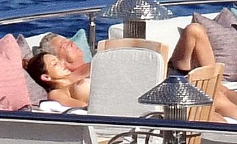 Katharine McPhee sunbathing topless on a yacht in Capri