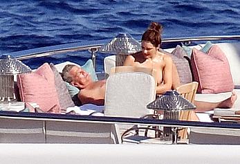 Katharine McPhee sunbathing topless on a yacht in Capri