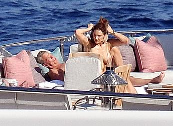 Katharine McPhee sunbathing topless on a yacht in Capri