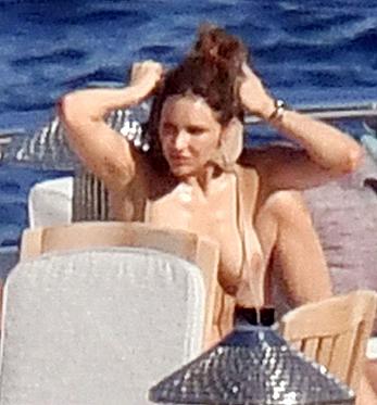 Katharine McPhee sunbathing topless on a yacht in Capri