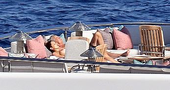 Katharine McPhee sunbathing topless on a yacht in Capri