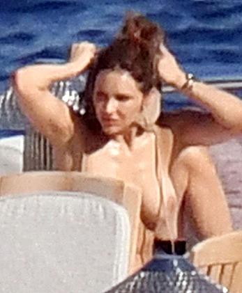 Katharine McPhee sunbathing topless on a yacht in Capri