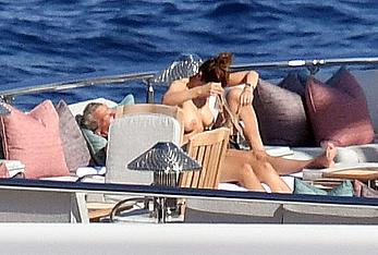 Katharine McPhee sunbathing topless on a yacht in Capri