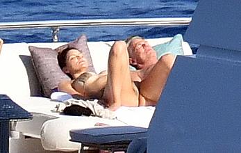 Katharine McPhee sunbathing topless on a yacht in Capri