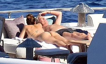 Katharine McPhee sunbathing topless on a yacht in Capri